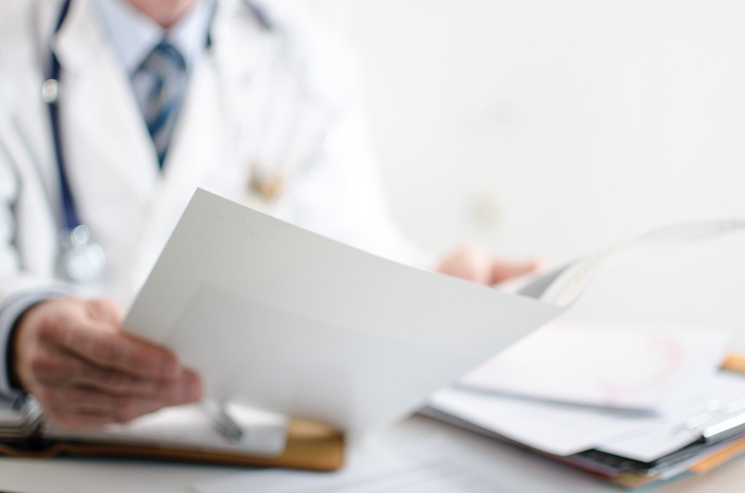 Doctor reading medical notes